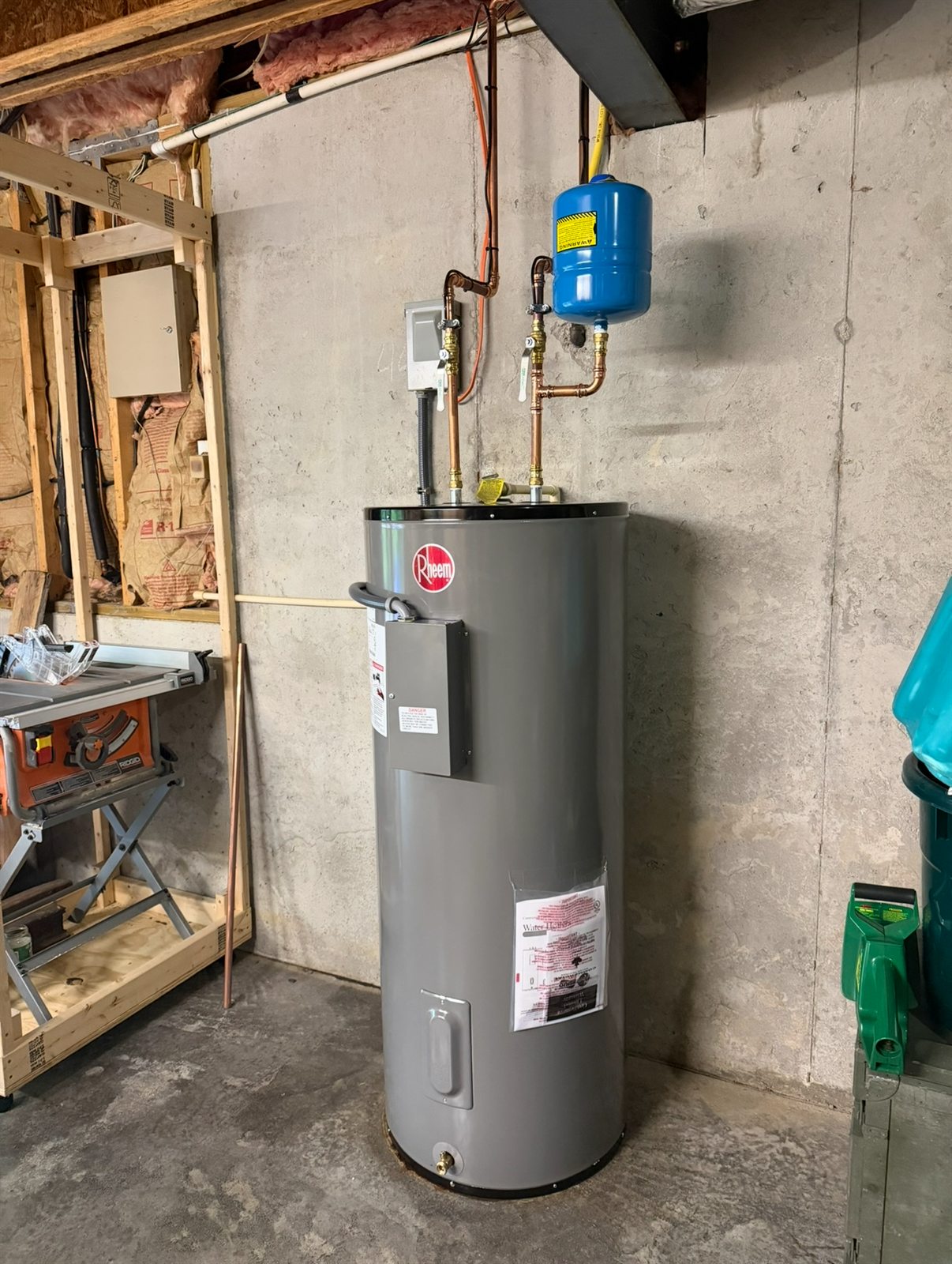 Completed Rheem water heater installation with expansion tank